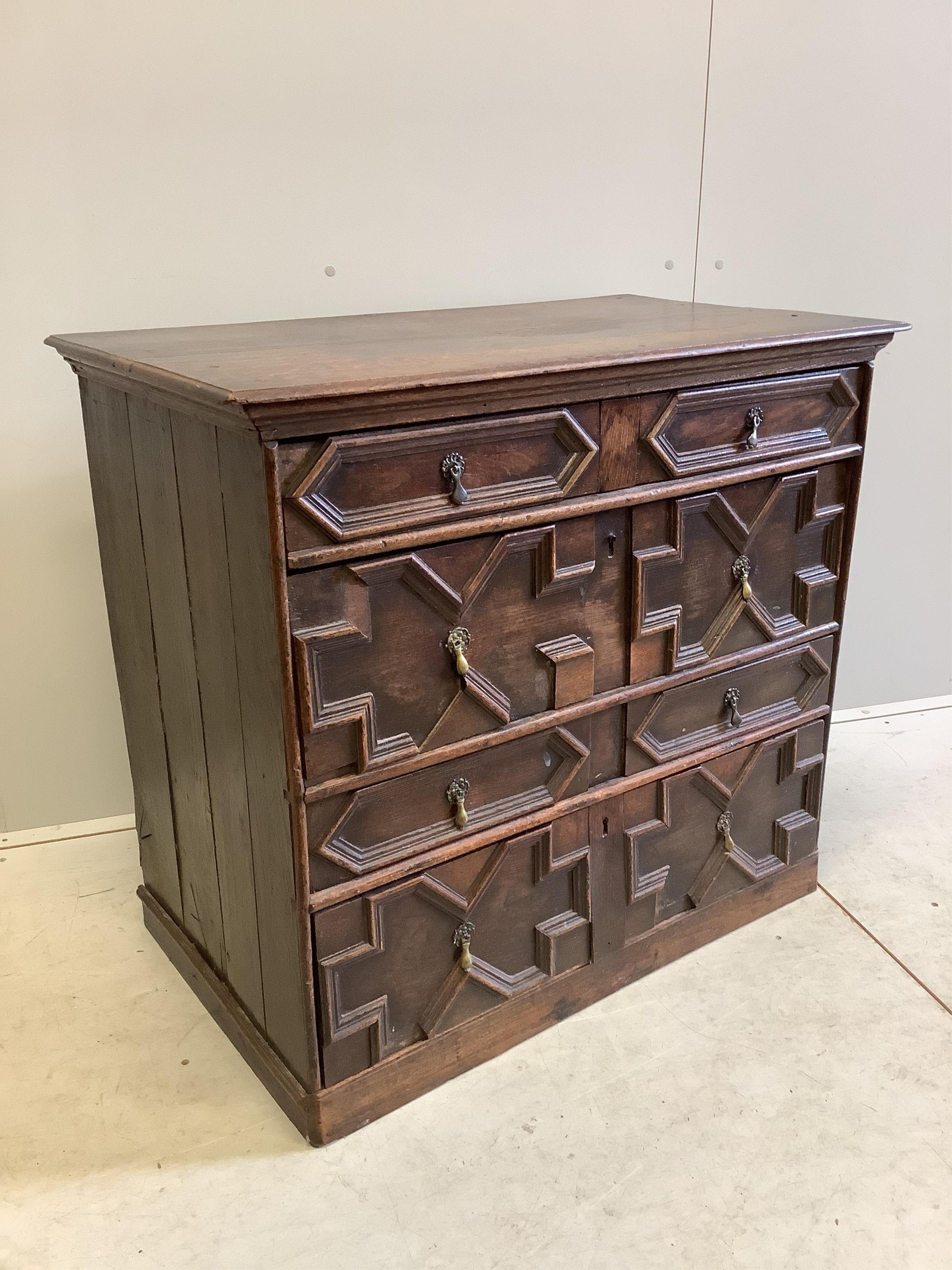 An 18th century geometric moulded oak chest, width 95cm, depth 54cm, height 86cm. Condition - fair